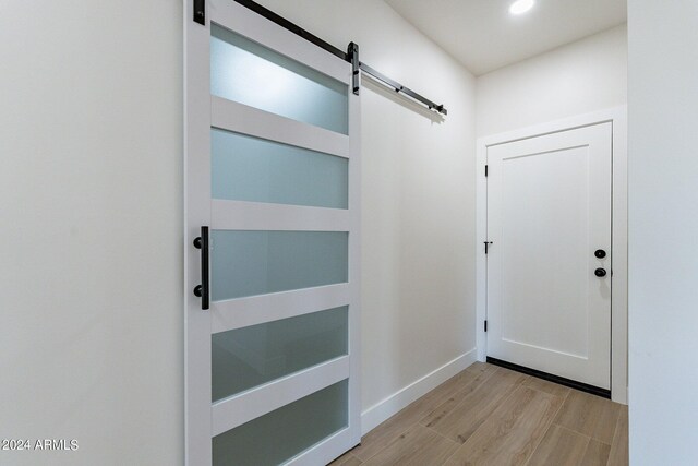 3909 S Veronica Ln, Gold Canyon, AZ 85118 - entryway featuring light wood-type flooring, recessed lighting, baseboards, and a barn door