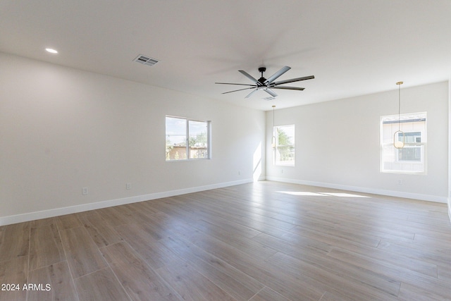 3909 S Veronica Ln, Gold Canyon, AZ 85118 - unfurnished room featuring visible vents, light wood-type flooring, baseboards, and ceiling fan