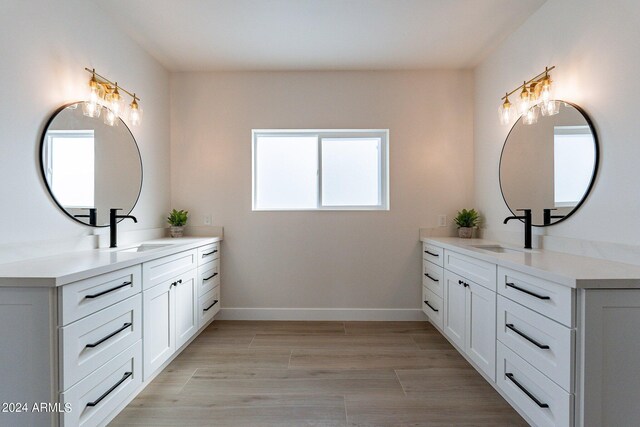 3909 S Veronica Ln, Gold Canyon, AZ 85118 - full bath featuring two vanities, baseboards, a sink, and wood finished floors