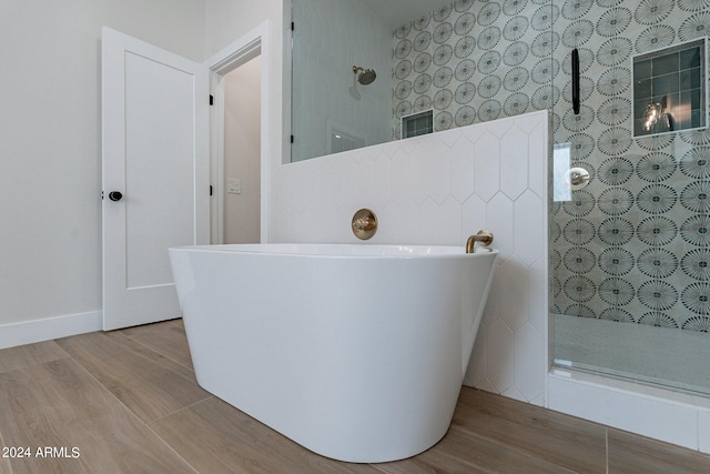 3909 S Veronica Ln, Gold Canyon, AZ 85118 - full bath featuring a walk in shower, wood finished floors, and a freestanding tub