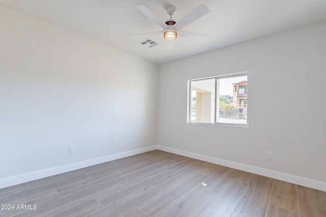 3909 S Veronica Ln, Gold Canyon, AZ 85118 - unfurnished room with light wood-type flooring, baseboards, a ceiling fan, and visible vents