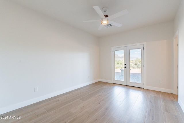 3909 S Veronica Ln, Gold Canyon, AZ 85118 - empty room featuring visible vents, baseboards, a ceiling fan, light wood-style floors, and french doors