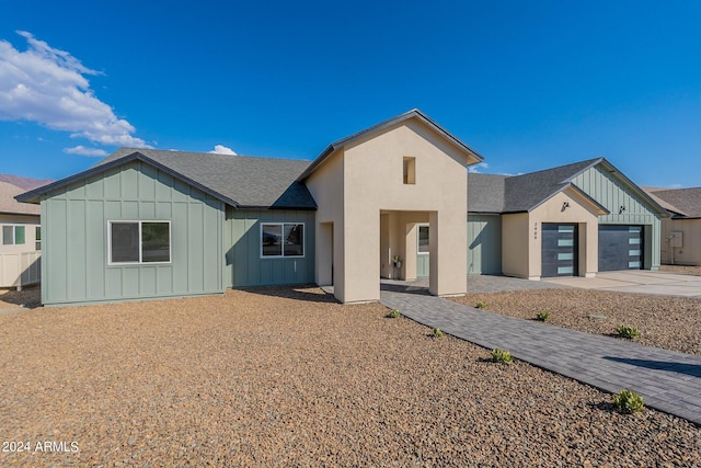 3909 S Veronica Ln, Gold Canyon, AZ 85118 - single story home featuring an attached garage, roof with shingles, board and batten siding, and driveway