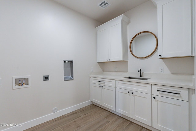 3909 S Veronica Ln, Gold Canyon, AZ 85118 - laundry area with visible vents, a sink, hookup for an electric dryer, cabinet space, and hookup for a washing machine