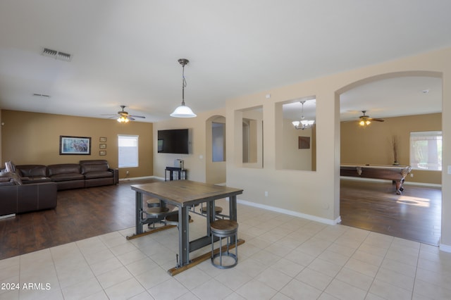 dining space with a healthy amount of sunlight, ceiling fan, billiards, and light hardwood / wood-style flooring