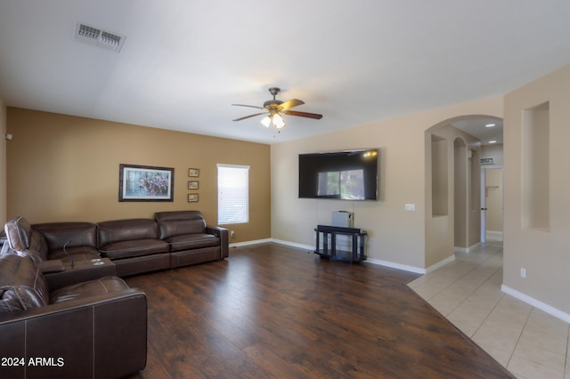 living room with ceiling fan and hardwood / wood-style flooring