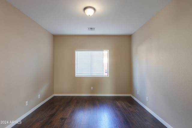 empty room featuring dark hardwood / wood-style floors