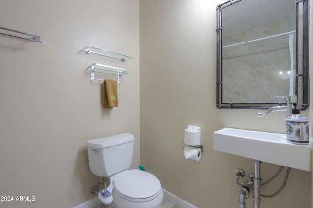 bathroom with walk in shower and toilet