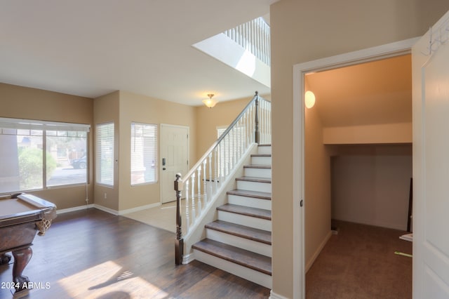 staircase featuring hardwood / wood-style flooring