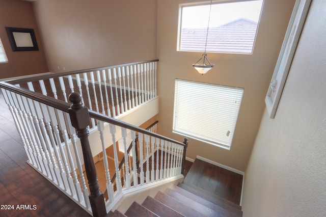 staircase featuring hardwood / wood-style floors