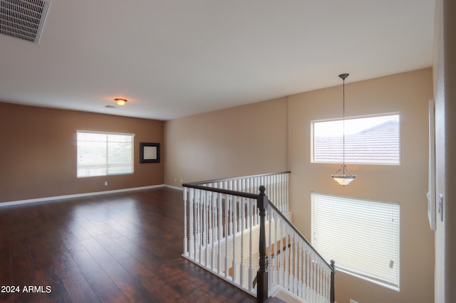 hallway featuring dark hardwood / wood-style floors