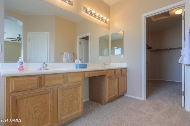 bathroom with ceiling fan and vanity