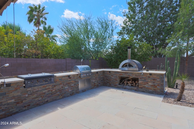 view of patio / terrace with area for grilling and exterior kitchen