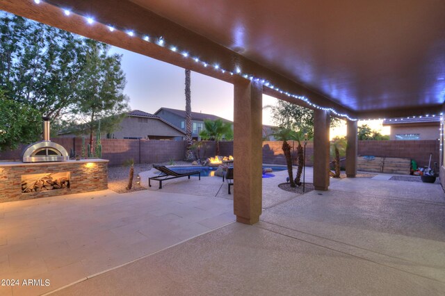 view of swimming pool featuring an in ground hot tub and a patio area