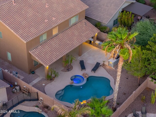 view of patio terrace at dusk