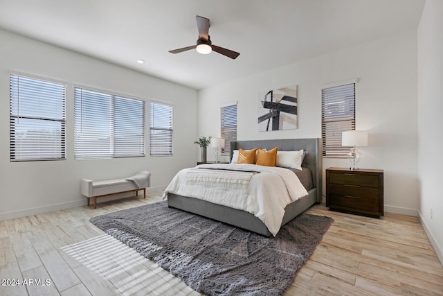 bedroom featuring ceiling fan and light hardwood / wood-style floors