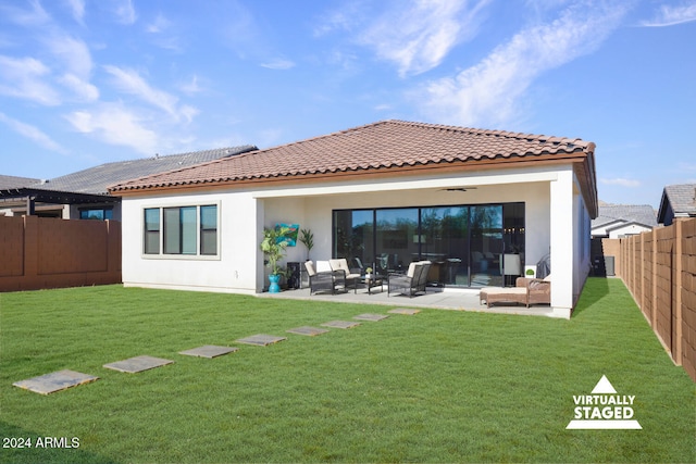 back of property featuring a yard, a patio, an outdoor living space, and ceiling fan