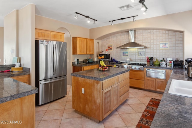 40834 N 26th St, Cave Creek, AZ 85331 - kitchen with stainless steel appliances, wall chimney exhaust hood, a warming drawer, a center island, and light tile patterned floors