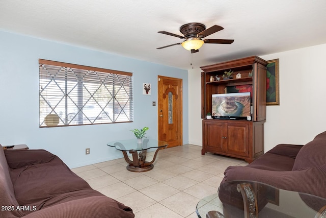 tiled living room featuring ceiling fan