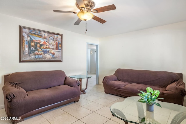 living room featuring light tile patterned flooring and ceiling fan