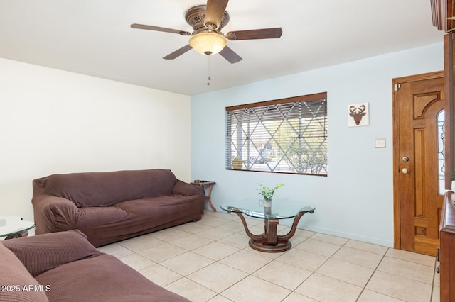 tiled living room featuring ceiling fan