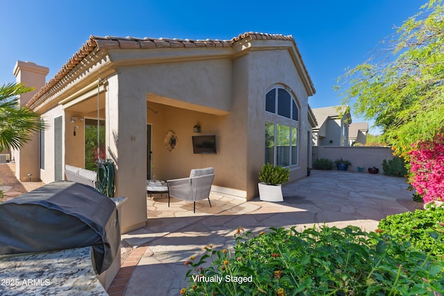 9475 N 115th Pl, Scottsdale, AZ 85259 - view of front of home with a patio area, stucco siding, and a tiled roof