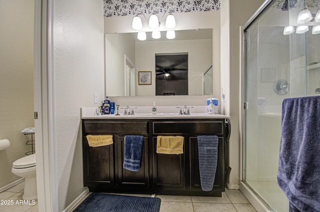 bathroom with ceiling fan, an enclosed shower, vanity, tile patterned floors, and toilet