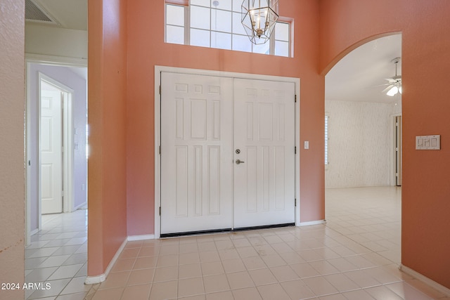 tiled entrance foyer with ceiling fan