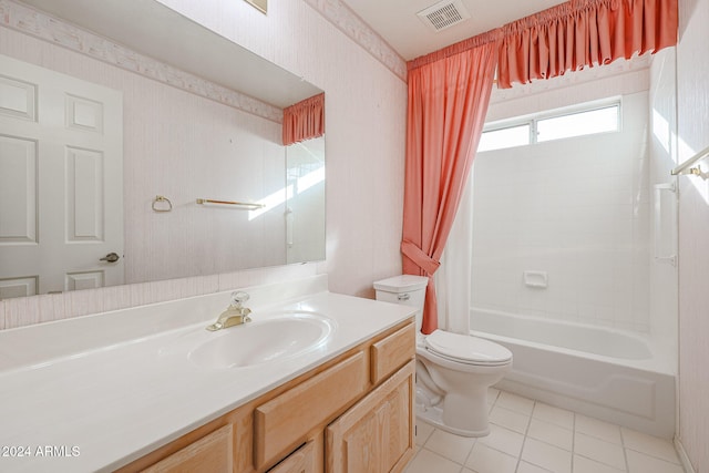 full bathroom featuring tile patterned flooring, vanity, shower / tub combo with curtain, and toilet