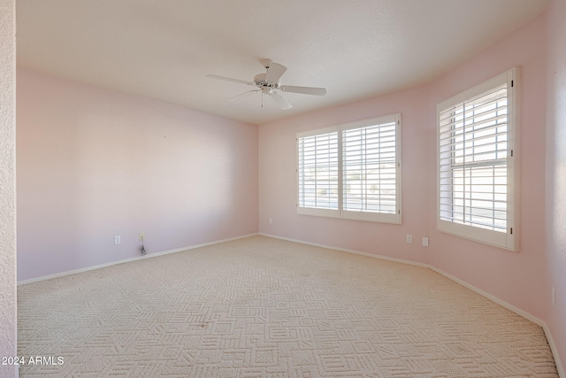 carpeted empty room with ceiling fan