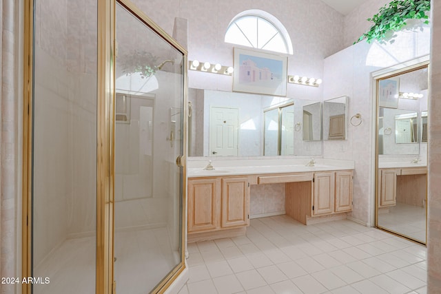 bathroom featuring vanity, tile patterned floors, and an enclosed shower