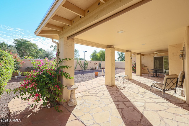 view of patio featuring ceiling fan