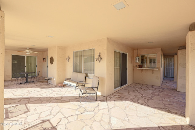 view of patio / terrace featuring ceiling fan