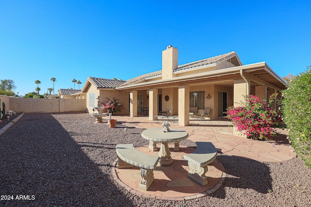 rear view of property with a patio