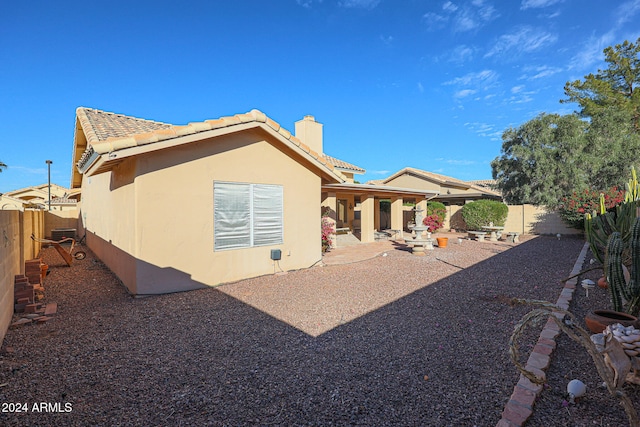 back of property featuring a patio area