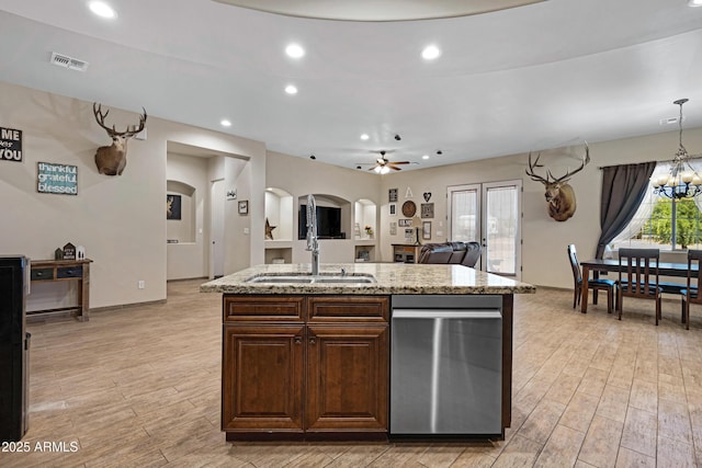 1008 E Mano Dr, New River, AZ 85087 - kitchen featuring a sink, arched walkways, stainless steel dishwasher, a kitchen island with sink, and ceiling fan