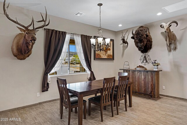 1008 E Mano Dr, New River, AZ 85087 - dining space featuring light wood-style floors, a chandelier, baseboards, and recessed lighting