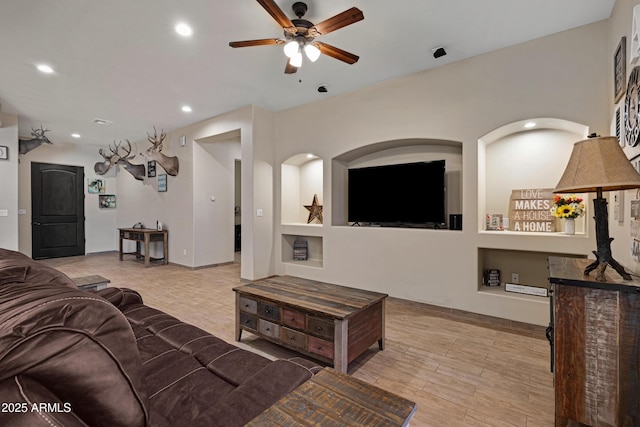 1008 E Mano Dr, New River, AZ 85087 - living area featuring ceiling fan, recessed lighting, built in shelves, and wood finished floors