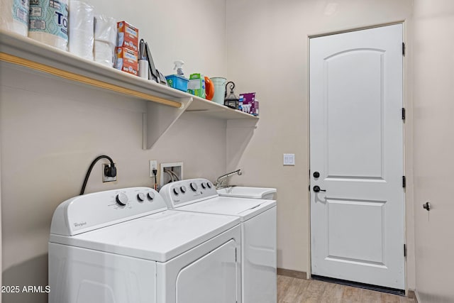 1008 E Mano Dr, New River, AZ 85087 - laundry area with light wood-style flooring, washing machine and clothes dryer, and baseboards