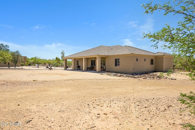 1008 E Mano Dr, New River, AZ 85087 - rear view of house with stucco siding, a patio area, and a tile roof
