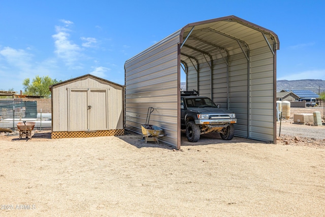 1008 E Mano Dr, New River, AZ 85087 - view of shed with a detached carport and a mountain view