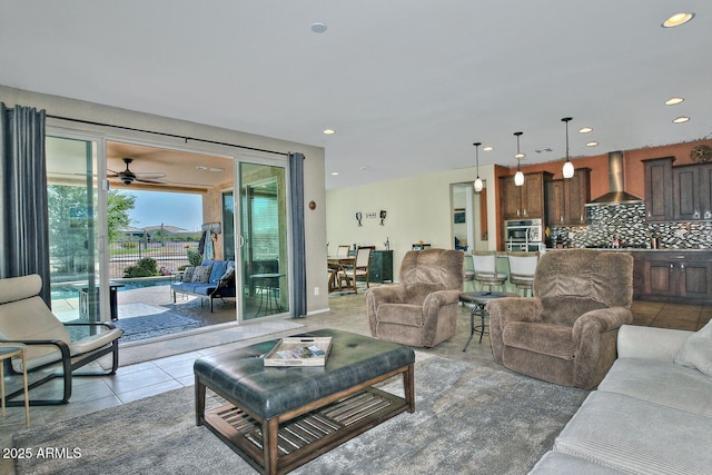 living area with light tile patterned floors and recessed lighting