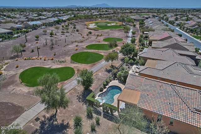 birds eye view of property featuring view of golf course and a residential view