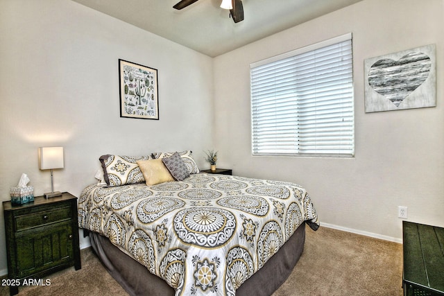 carpeted bedroom featuring baseboards and a ceiling fan