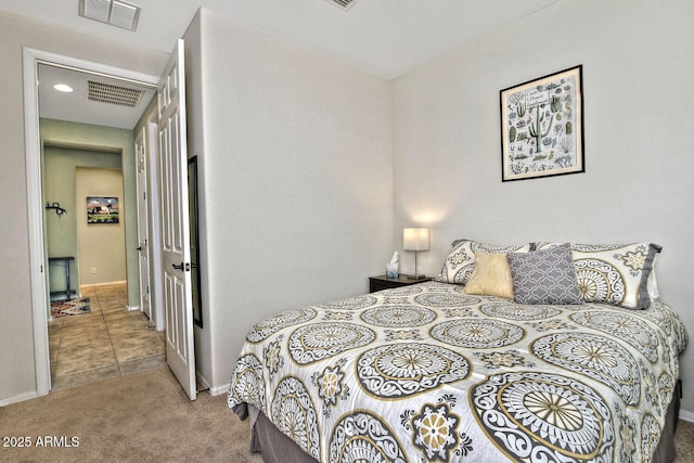 bedroom with carpet flooring, visible vents, and baseboards