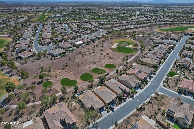 aerial view with golf course view and a residential view