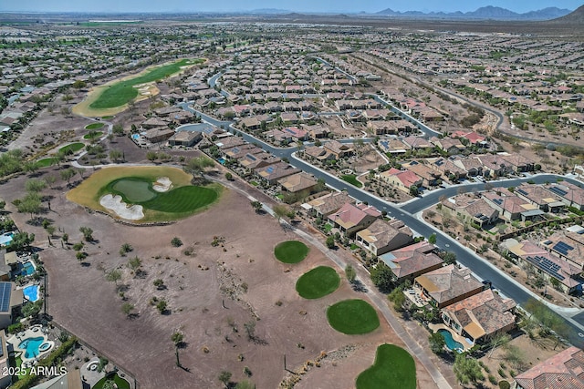 aerial view with a mountain view, golf course view, and a residential view