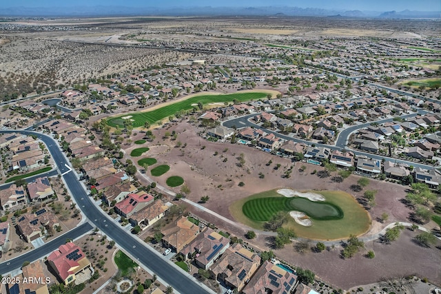 drone / aerial view with a residential view and view of golf course