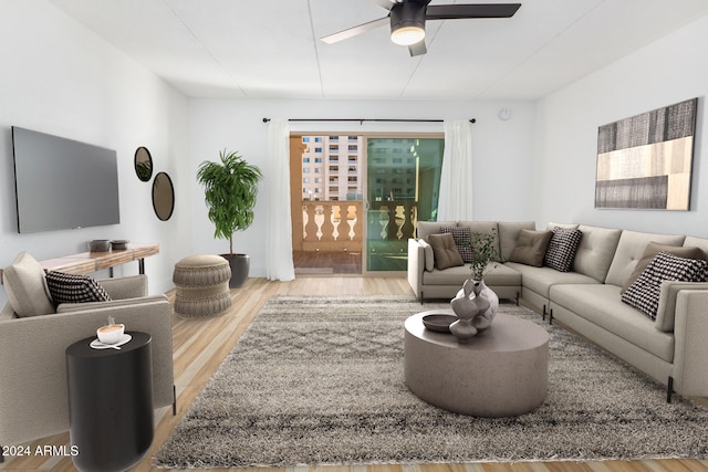 living room with wood-type flooring and ceiling fan