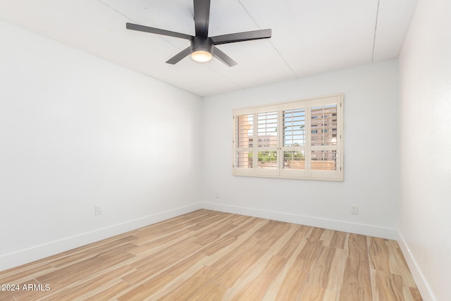 spare room featuring ceiling fan and hardwood / wood-style floors